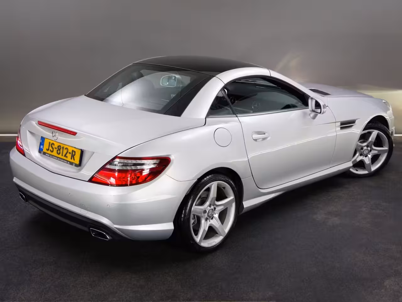 Mercedes-Benz SLK-klasse 200 AMG-Line (SFEERVERLICHTING, STOEL- & NEKVERWARMING, NAVIGATIESYSTEEM, CRUISE CONTROL,