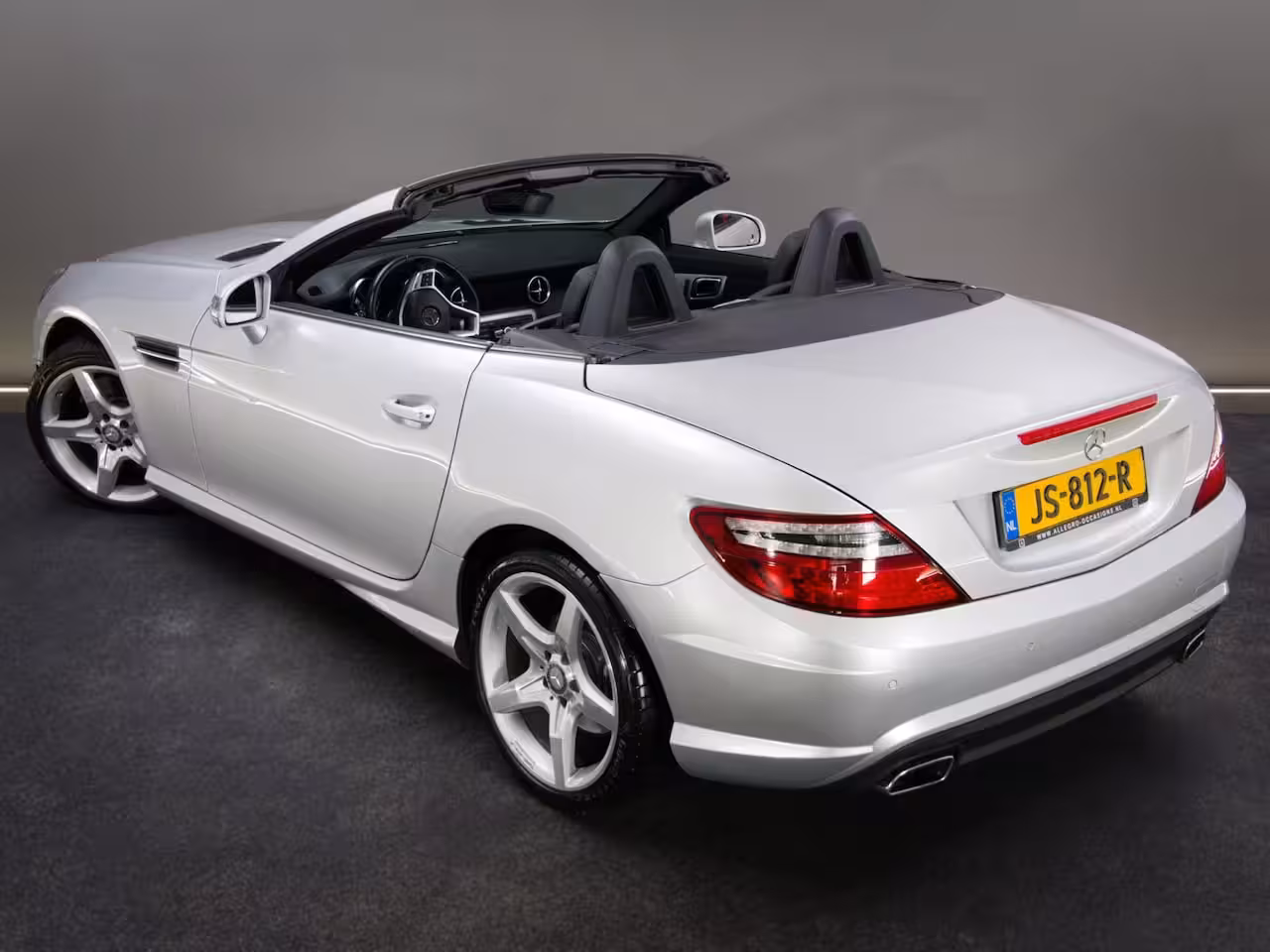 Mercedes-Benz SLK-klasse 200 AMG-Line (SFEERVERLICHTING, STOEL- & NEKVERWARMING, NAVIGATIESYSTEEM, CRUISE CONTROL,