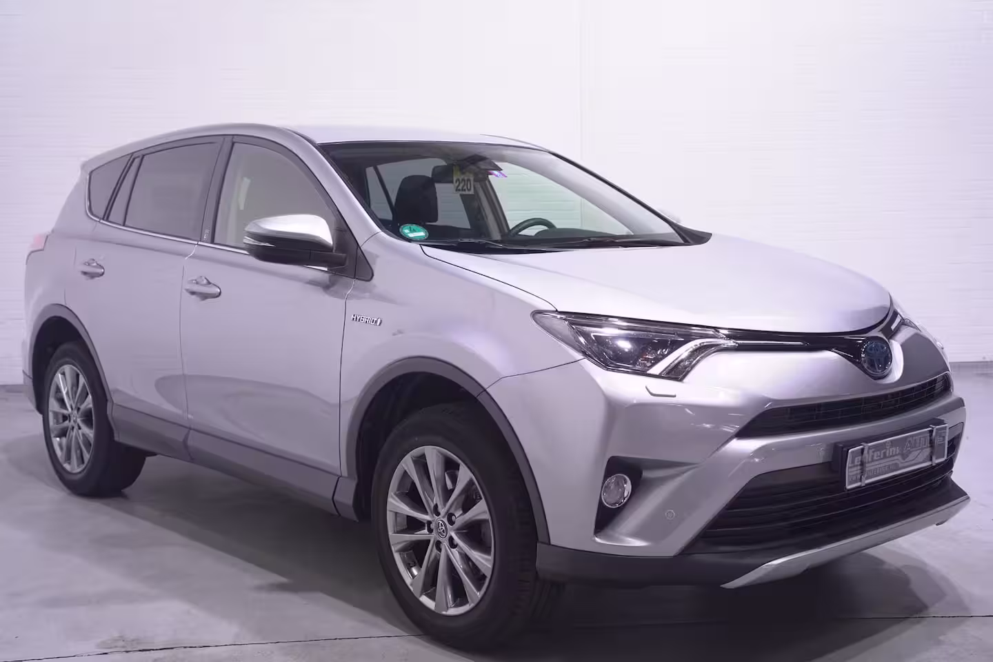 Toyota RAV4 2.5 Hybrid AWD Energy Team-Duitsland navigatie camera 1650kg trekgewicht onderhouds histor
